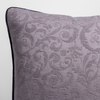 Adele Throw Pillow | French Lavender | a close up of the corner of a pillow showing the jacquard pattern and silk velvet trim.