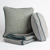 Adele Blanket | Organic cotton damask throw pillows and throw blanket on a white background.