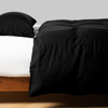 Austin Duvet Cover | Corvino | Midweight linen duvet cover  on a bed, side view.