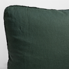 Austin Throw Pillow | Juniper | close up of midweight linen pillow corner with raw edges trimming its gusset.