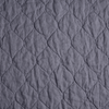 Austin Coverlet | French Lavender | a close up of quilted midweight linen fabric in french lavender, a neutral violet tone.