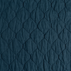 Austin Coverlet | Midnight | A close up of quilted midweight linen fabric in midnight, a rich indigo tone.