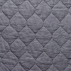 Austin Coverlet | Moonlight | A close up of quilted midweight linen fabric in moonlight, a saturated, cool, mid-dark grey tone.