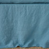 Cenote | Close up of the Austin bed skirt in cenote, highlighting its tailored, ungathered style.