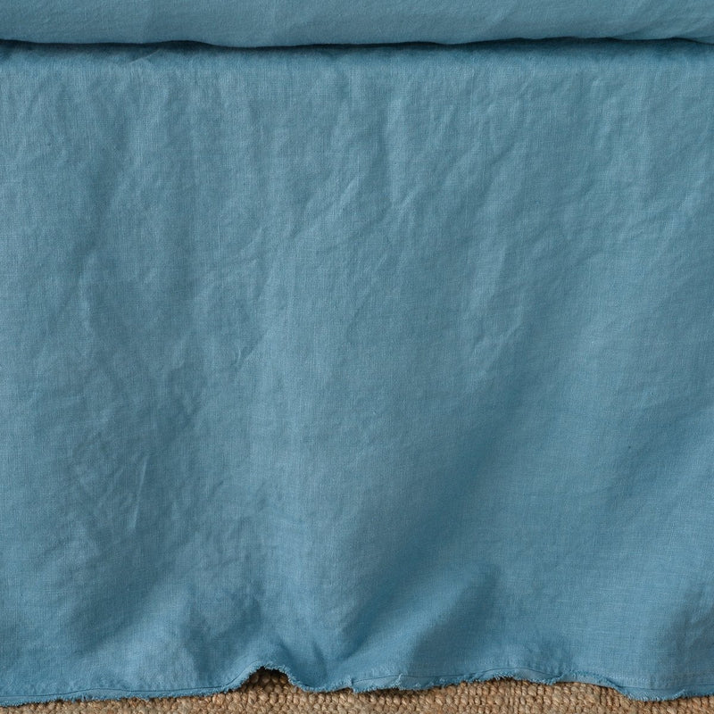 Cenote | Close up of the Austin bed skirt in cenote, highlighting its tailored, ungathered style.