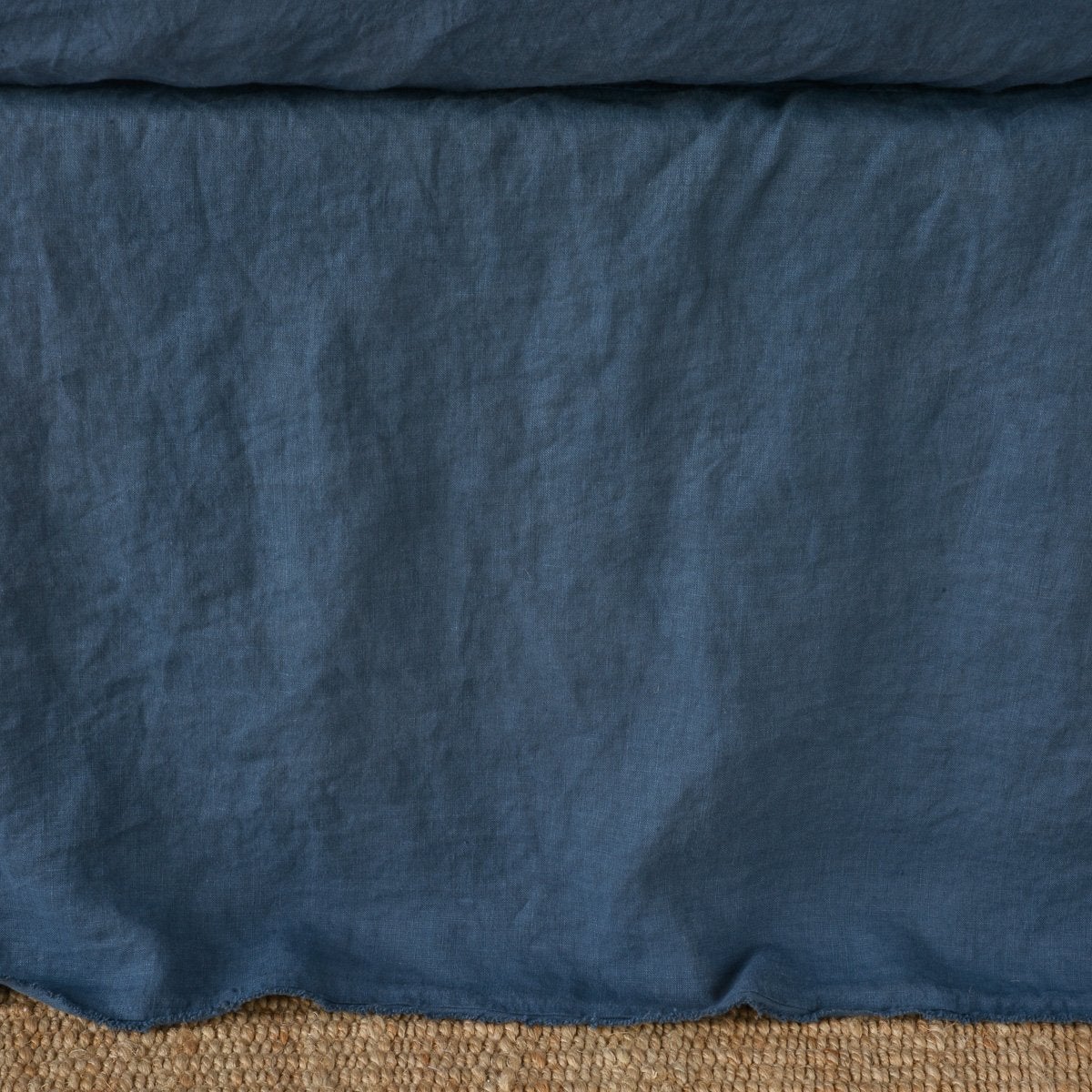 Midnight | Close up of the Austin bed skirt in midnight, highlighting its tailored, ungathered style.