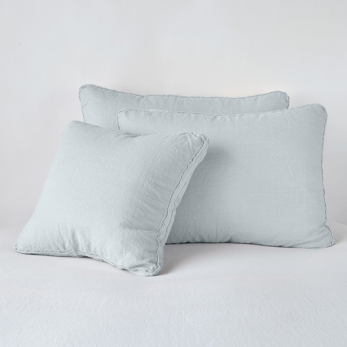 Austin Sham | Cloud | Midweight linen shams in cloud colorway shown leaning upright on white background.