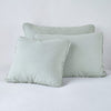 Austin Sham | Eucalyptus | Midweight linen shams in eucalyptus colorway shown leaning upright on white background.