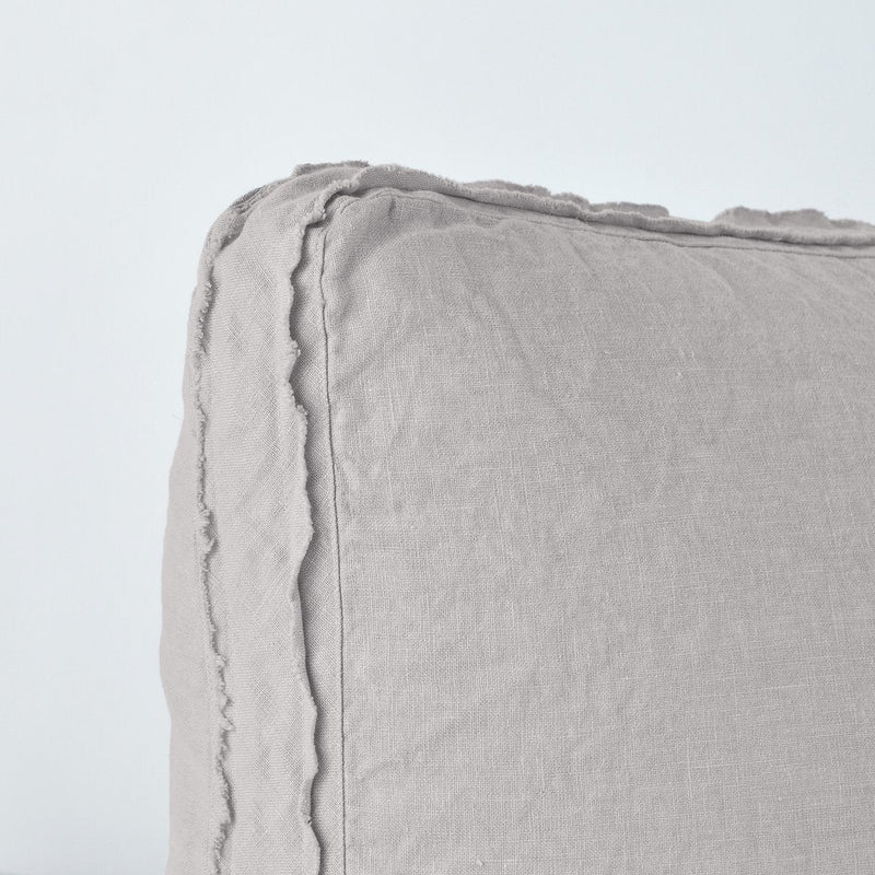 Fog | Close up angle of the corner of an Austin sham in fog, highlighting the raw edge trim on either side of the gusset.