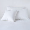 Austin Sham | White | Midweight linen shams in white colorway shown leaning upright on white background.