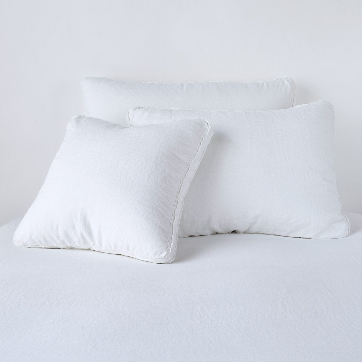 Austin Sham | White | Midweight linen shams in white colorway shown leaning upright on white background.