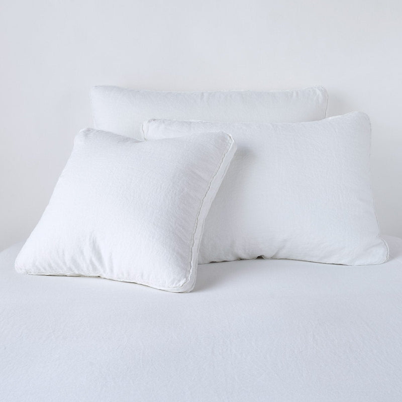 Austin Sham | White | Midweight linen shams in white colorway shown leaning upright on white background.