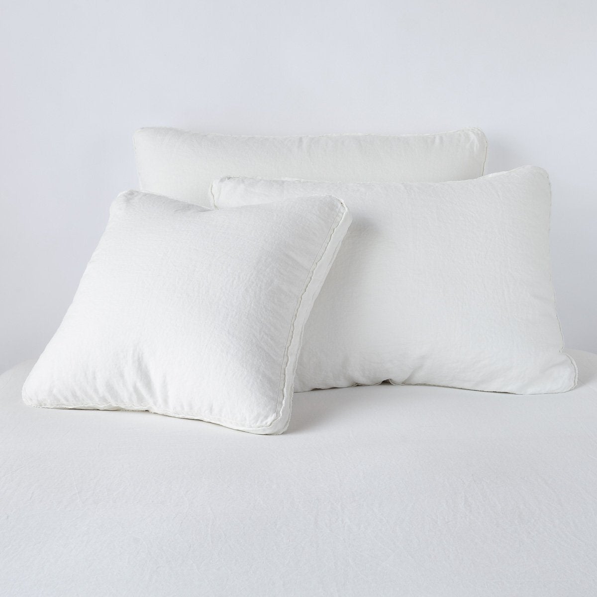 Austin Sham | Winter White | Midweight linen shams in winter white colorway shown leaning upright on white background.