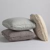 Austin Throw Pillow | Three midweight linen throw pillows on a white background. Pillows shown in Eucalyptus, Moonlight and Parchment.