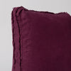 Austin Throw Pillow | Fig | close up of midweight linen pillow corner with raw edges trimming its gusset.
