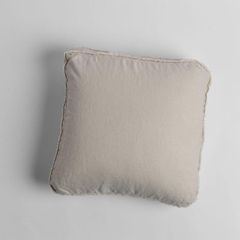 Austin Throw Pillow | Parchment | midweight linen 18x18 inch throw pillow shot from overhead against a white background.
