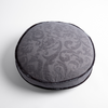 Adele Throw Pillow | Moonlight | Organic cotton damask round pillow with silk velvet trim on white background — overhead angle.