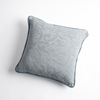 Adele Throw Pillow | Cloud | Organic cotton damask square pillow with silk velvet trim on white background — overhead angle.