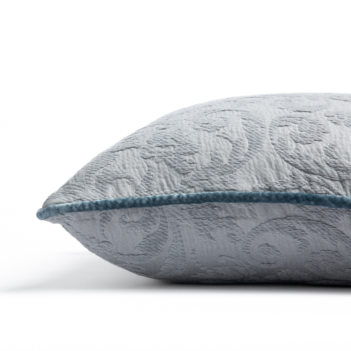 Adele Throw Pillow | Mineral | Organic cotton damask square pillow with silk velvet trim on white background — side angle.