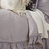 Linen whisper duvet cover with parchment sheets and sleeping pillow - close-up three-quarter angle.