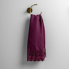 Mattine Guest Towel | Fig | linen with mattine lace trimmed guest towel on a decorative towel ring mounted on a white wall.