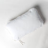 Harlow Throw Pillow | White | cotton velvet 15x24 throw pillow shot from overhead against a white background.