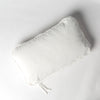 Harlow Throw Pillow | Winter White | cotton velvet 15x24 pillow shot from overhead against a white background.