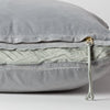 Harlow Throw Pillow | Mineral | Close-up of charmeuse gusset, raw-edge trim, and brass zipper detail on Harlow pillow - side view.