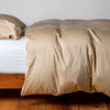 Bria Duvet Cover | Honeycomb | duvet cover and matching sleeping pillow on white sheeting - side view.