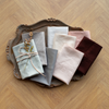 Bria Pillowcase (Single) | Bria pillowcases in a variety of colors neatly folded and fanned on a tray - overhead view.