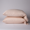 Bria Pillowcase (Single) | Pearl | Two cotton sateen sleeping pillows, stacked neatly against a white backdrop - side view.