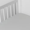 Bria Crib Sheet | Cloud | Cotton sateen crib sheet shown from a slight overhead angle into  an inside corner of a crib.