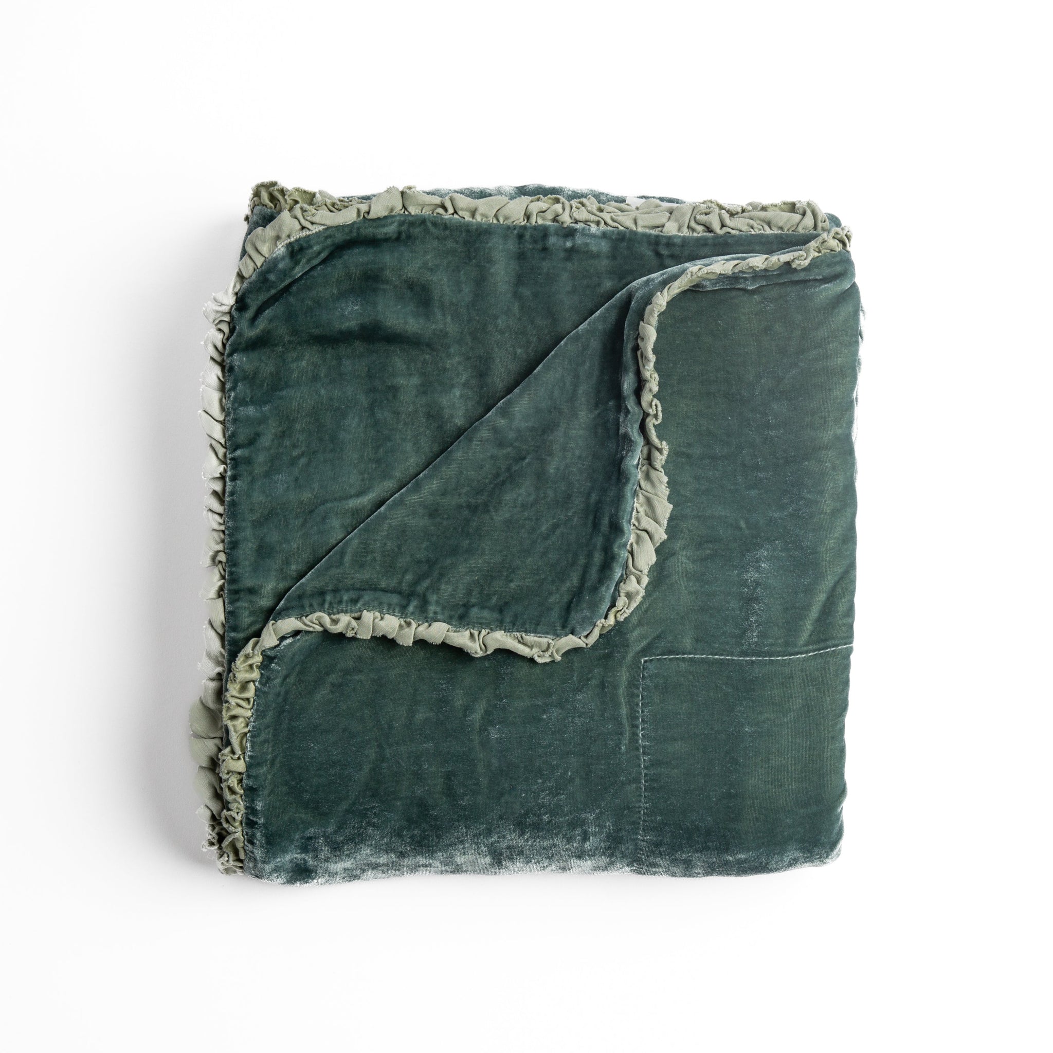 Carmen Blanket | Eucalyptus | silk velvet unfilled throw blanket with a petite charmeuse ruffle trim, overhead on a white background.