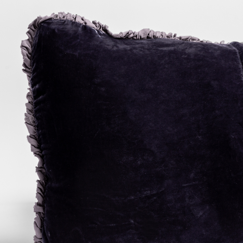 Carmen Throw Pillow | French Lavender | a close up of the corner of a charmeuse trimmed silk velvet pillow