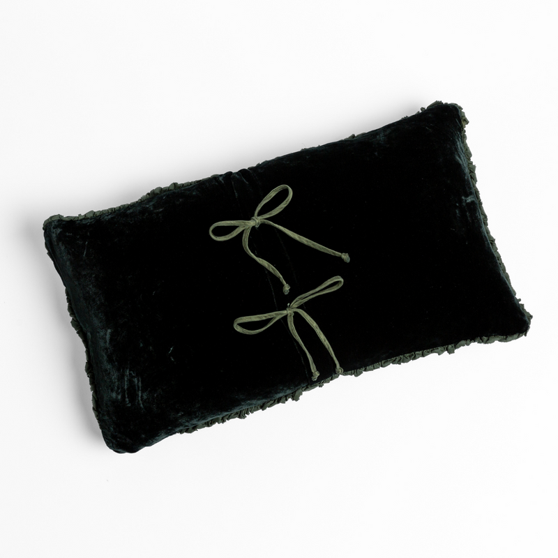 Carmen Throw Pillow | Juniper | silk velvet throw pillow with charmeuse trim shot overhead against a white background with its tie closures showing.