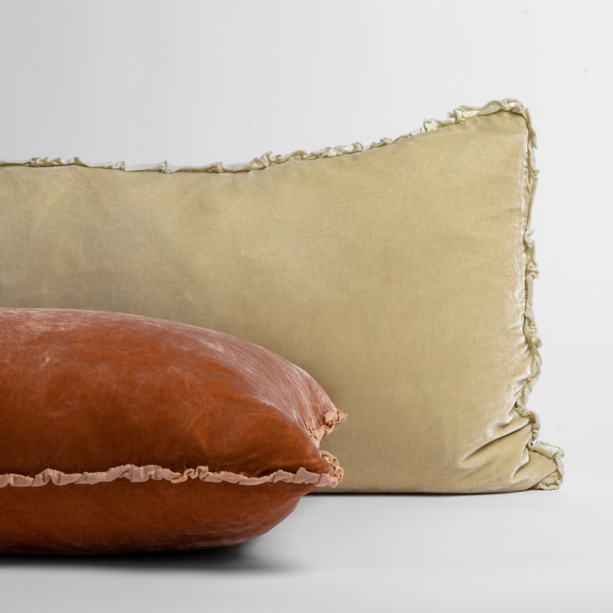 Carmen Throw Pillow | silk velvet pilows with a small charmeuse trim against a white background.