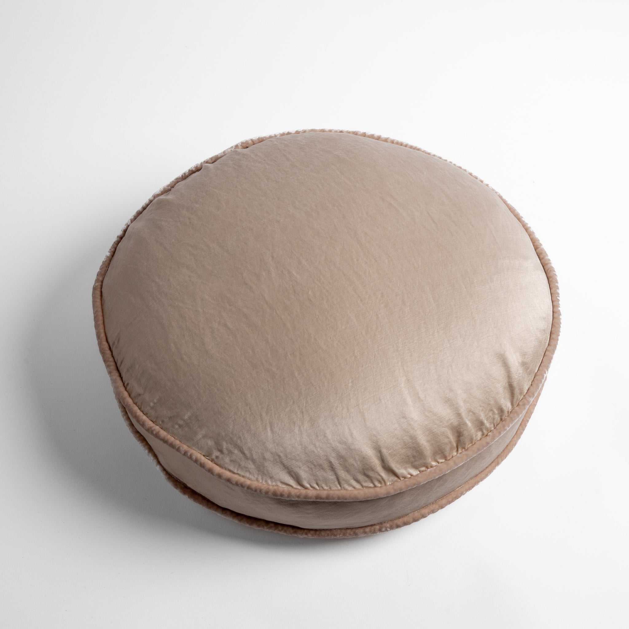Paloma Throw Pillow | Pearl | 18" round charmeuse pillow with silk velvet trim at gusset shot from overhead on a white background