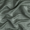 Paloma Duvet Cover | Eucalyptus | A close up of charmeuse fabric in eucalyptus, a soft light green.