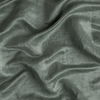 Paloma Blanket | Eucalyptus | A close up of charmeuse fabric in eucalyptus, a soft light green.