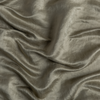 Paloma Crib Skirt | Fog | A close up of charmeuse fabric in fog, a neutral-warm, soft mid-tone grey.