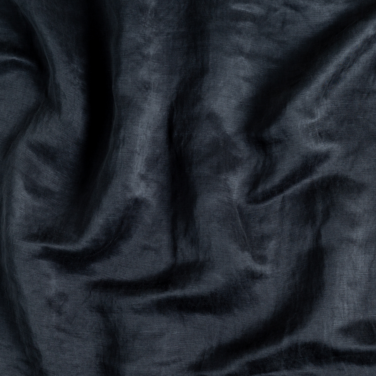 Paloma Throw Pillow | Midnight | A close up of charmeuse fabric in midnight, a rich indigo tone.