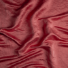 Taline Blanket | Poppy | A close up of charmeuse fabric in poppy, a warm coral pink.