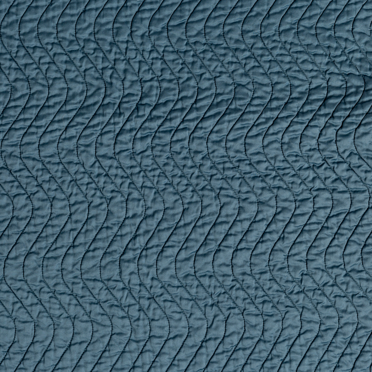 Cirillo Twin Coverlet | Cenote | A close up of quilted cotton sateen fabric in cenote, a vibrant, ocean-inspired blue-green.