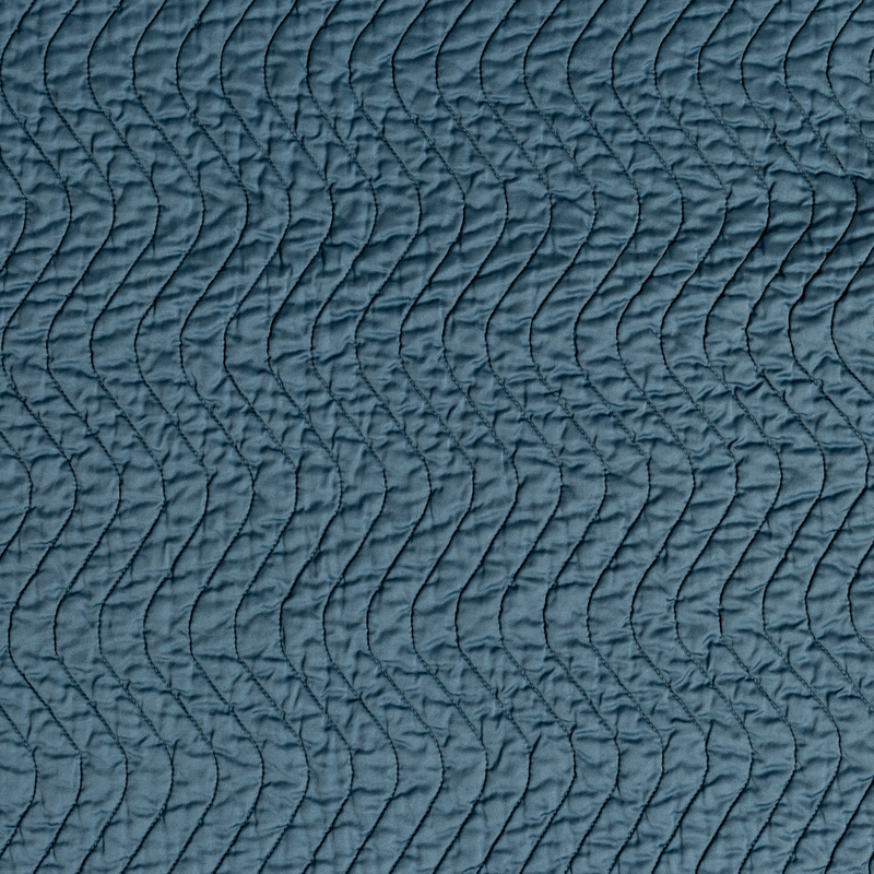 Cirillo Coverlet | Cenote | A close up of quilted cotton sateen fabric in cenote, a vibrant, ocean-inspired blue-green.