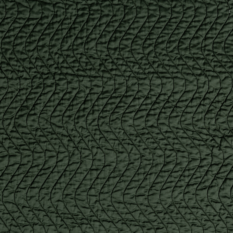Cirillo Twin Coverlet | Juniper | A close up of quilted cotton sateen fabric in Juniper, a deep green tone.