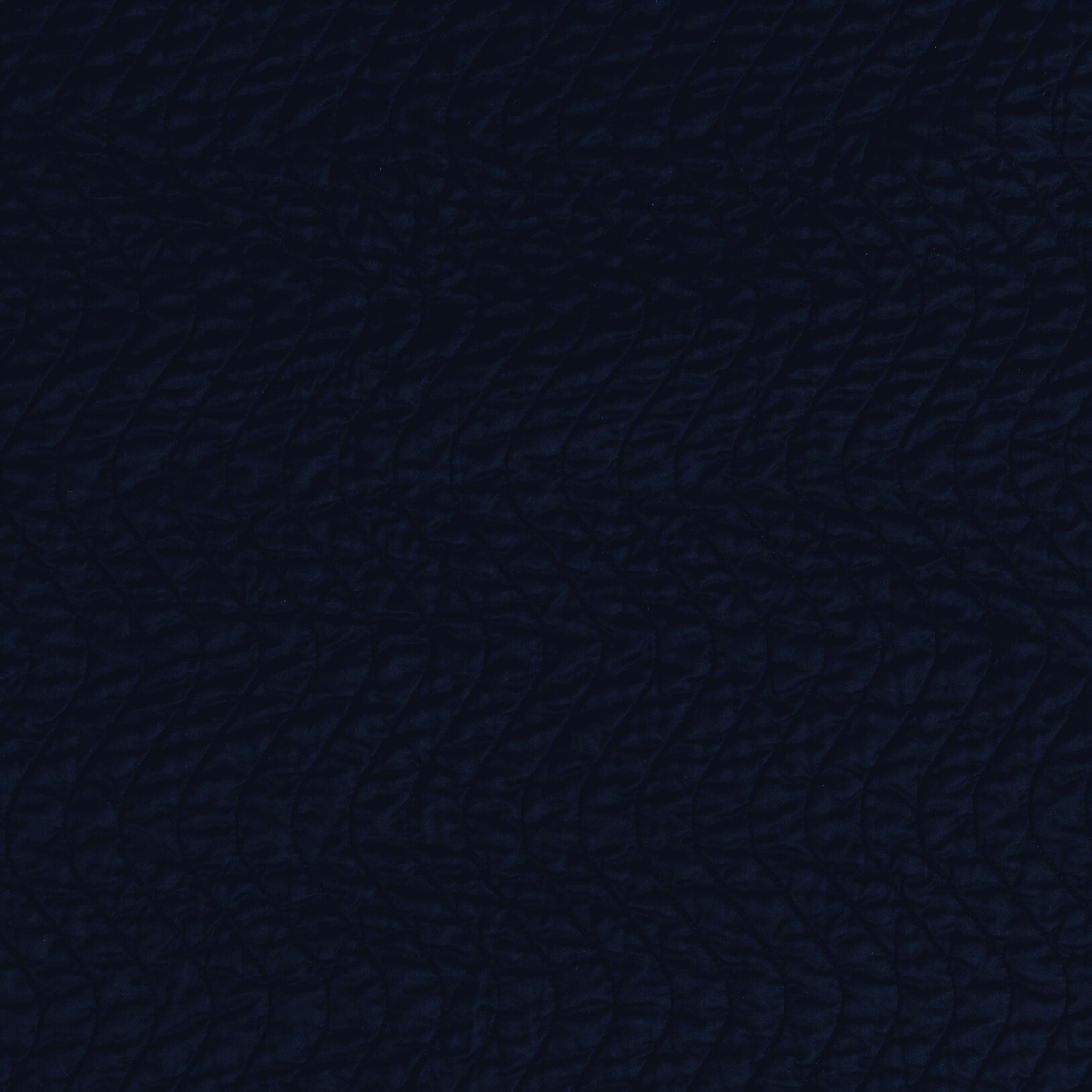 Cirillo Swatch Card | Corvino | A close up of quilted cotton sateen fabric in Corvino, a black tone.