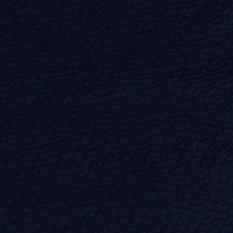 Cirillo Swatch Card | Corvino | A close up of quilted cotton sateen fabric in Corvino, a black tone.