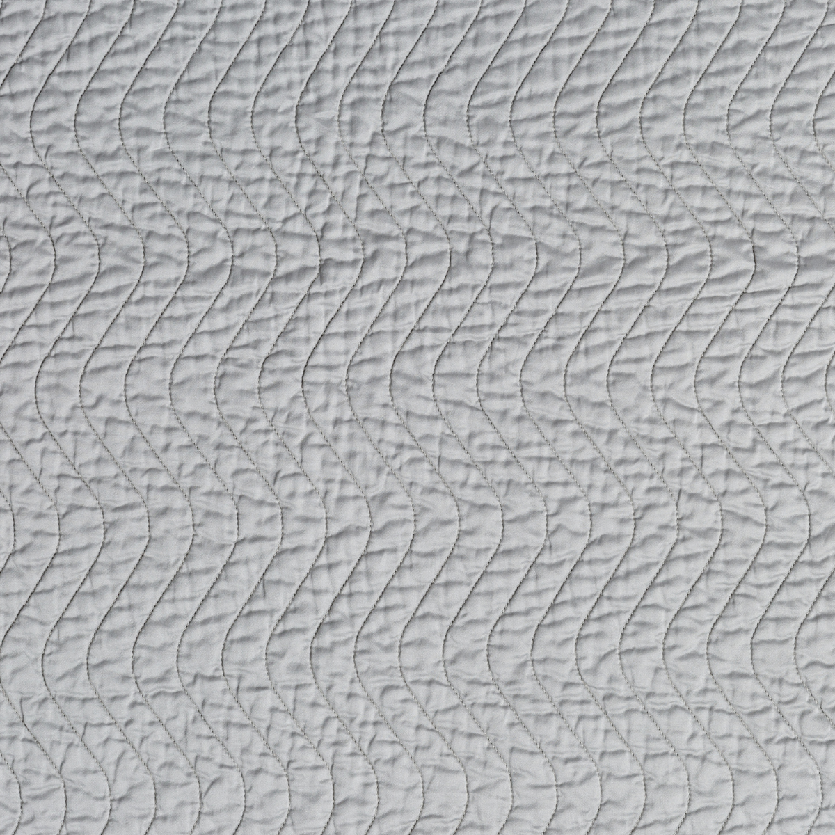 Cirillo Blanket | Mineral | A close up of quilted cotton sateen fabric in mineral, a soothing seafoam blue with subtle grey-green undertones.