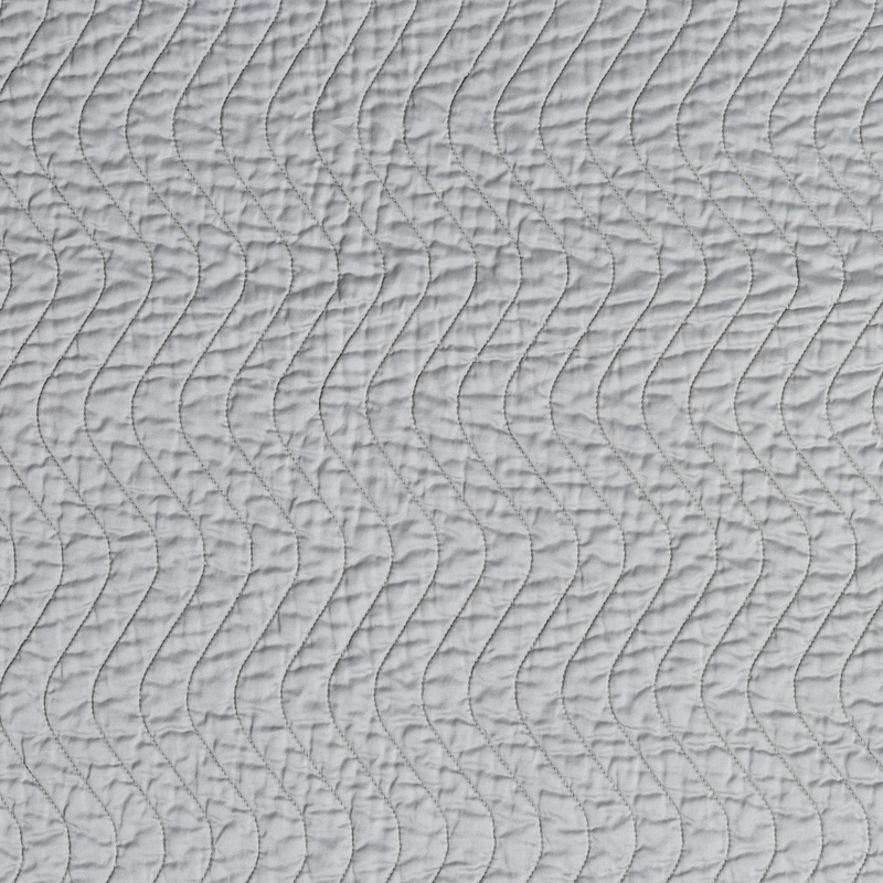 Cirillo Blanket | Mineral | A close up of quilted cotton sateen fabric in mineral, a soothing seafoam blue with subtle grey-green undertones.