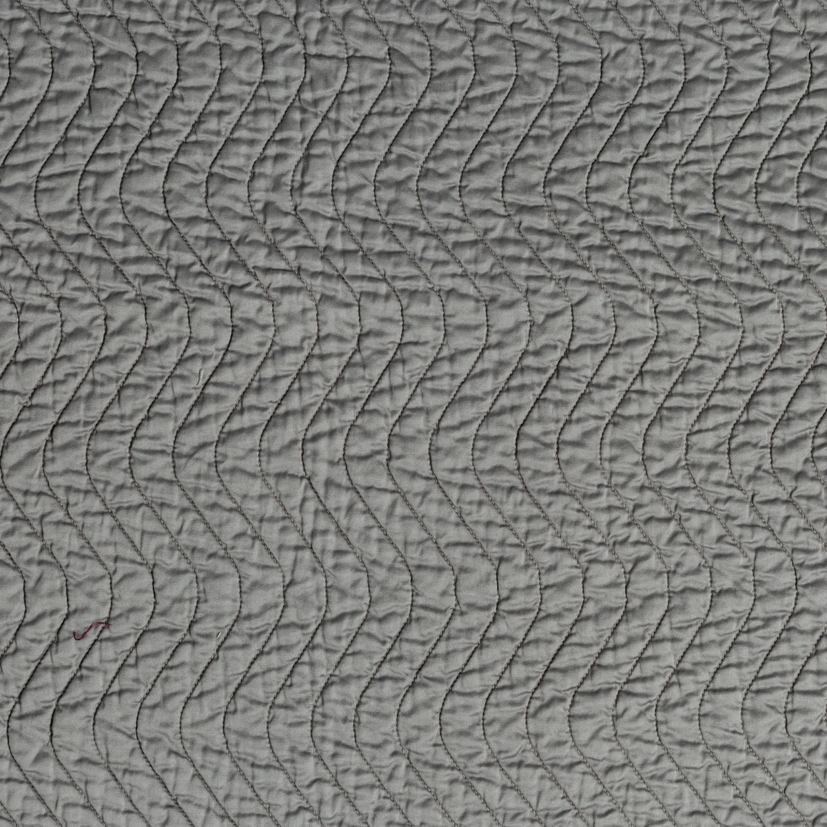 Cirillo Coverlet | Moonlight | A close up of quilted cotton sateen fabric in moonlight, a saturated, cool, mid-dark grey tone.